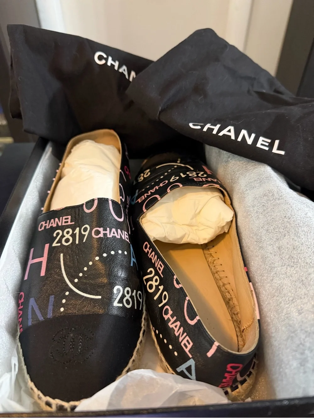Authentic CHANEL Black Canvas Espadrilles with Pink & Blue Logo Print